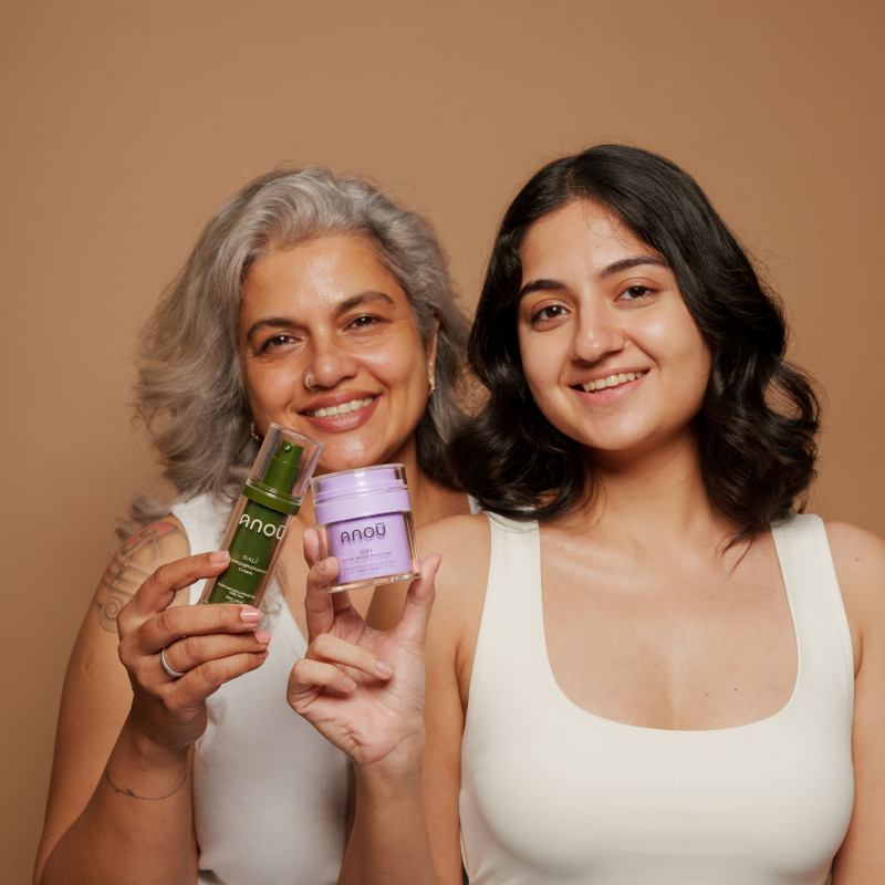 two happy women showing products