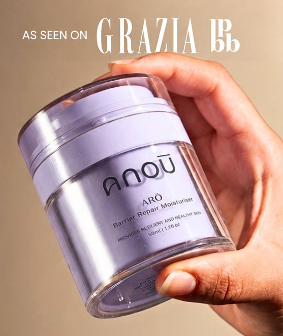 Anoū Arō 50 ml barrier repair moisturiser in a lilac jar held in a hand, with “As seen on Grazia and LBB” artwork.
